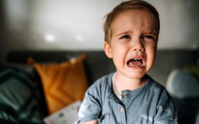 Photo of an upset screaming child to illustrate the article Are Humans Inherently Good or Evil?