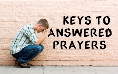 Photo of man crouching in front of wall in an attitude of prayer to illustrate the article 