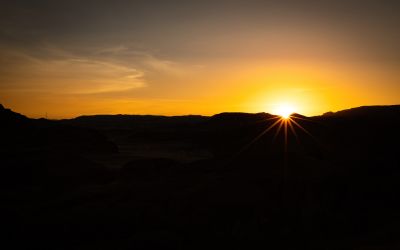 Photo of sun over Sinai mountains to illustrate the article No One Can See God and Live.